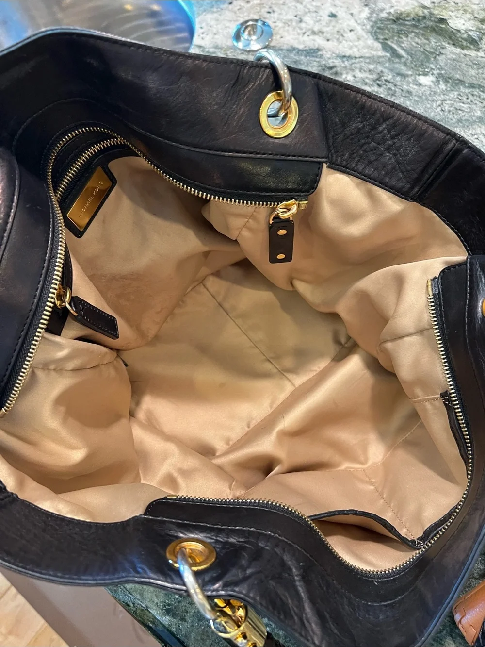 Michael Kors handles hardware pockets